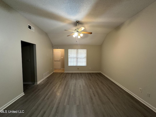 1664 Thomas St, Horn Lake, MS 38637 - unfurnished room featuring lofted ceiling, ceiling fan, dark wood-type flooring, baseboards, and a textured ceiling