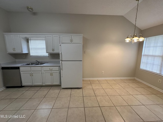 1664 Thomas St, Horn Lake, MS 38637 - kitchen with freestanding refrigerator, dishwasher, vaulted ceiling, a sink, and a chandelier
