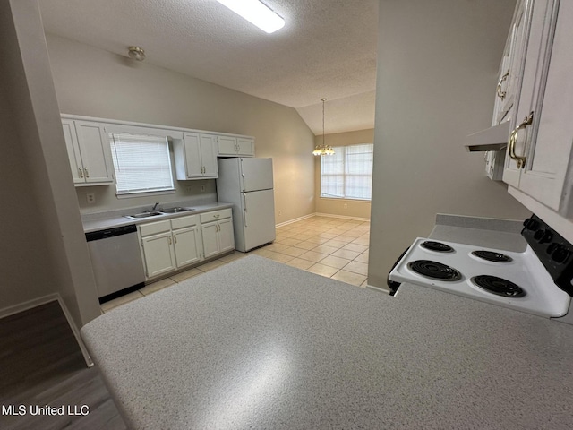 1664 Thomas St, Horn Lake, MS 38637 - kitchen featuring white appliances, a sink, lofted ceiling, a textured ceiling, and a chandelier