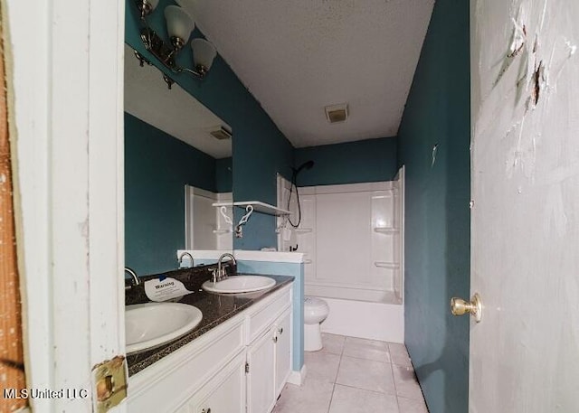 full bathroom with tub / shower combination, tile patterned floors, a textured ceiling, toilet, and vanity