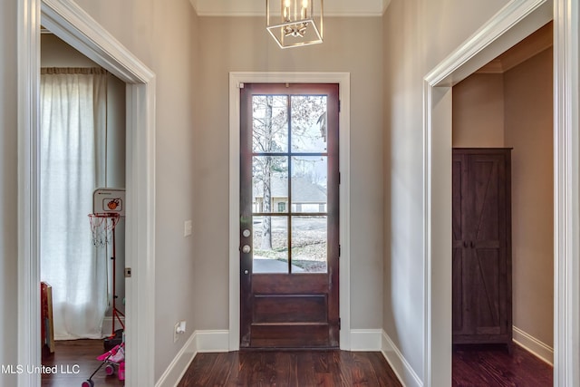 entrance foyer with dark wood-style flooring and baseboards