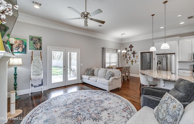 living room with ornamental molding, french doors, visible vents, and dark wood-type flooring