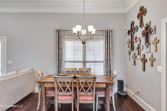 dining room featuring dark wood-style flooring, crown molding, baseboards, and an inviting chandelier