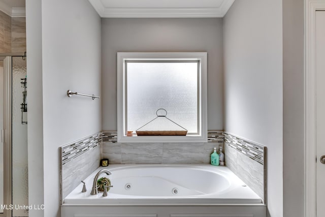 full bathroom with a jetted tub and crown molding