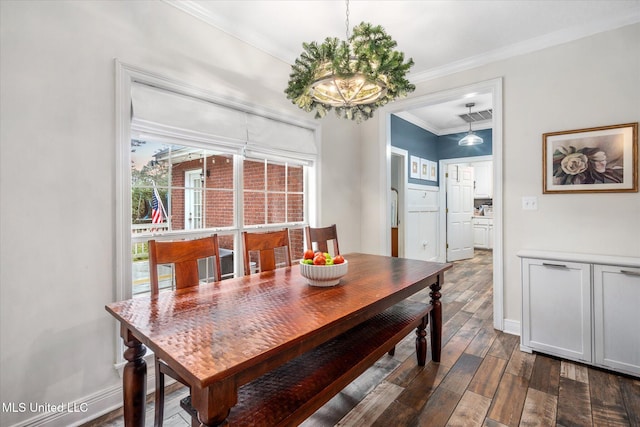 dining room featuring crown molding and dark hardwood / wood-style flooring