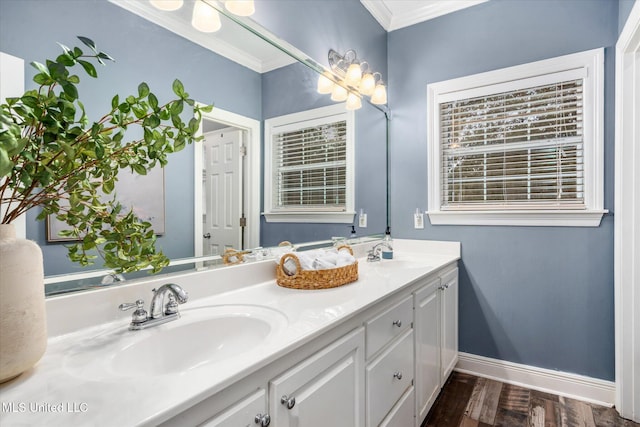 bathroom with crown molding, hardwood / wood-style floors, and vanity