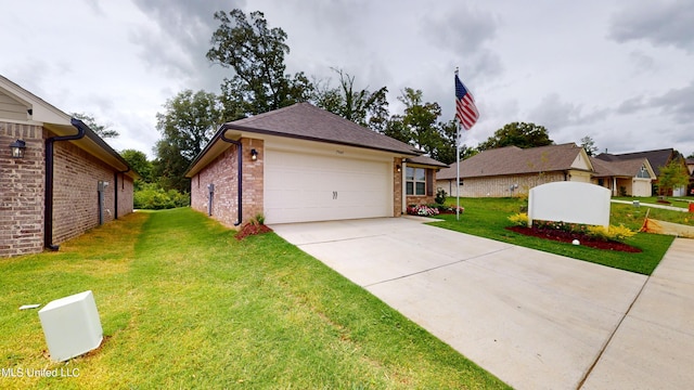 view of front of house with a front yard and a garage