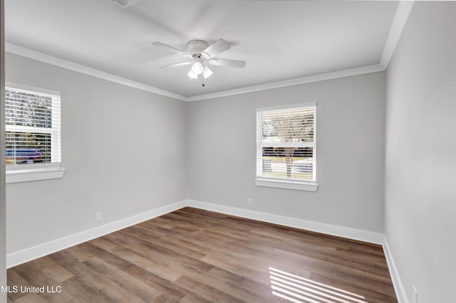 unfurnished room featuring a ceiling fan, crown molding, baseboards, and wood finished floors