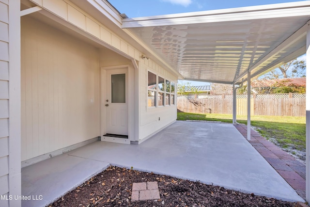 view of patio featuring fence