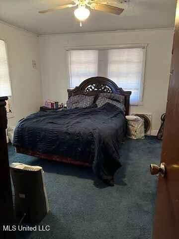 carpeted bedroom with ceiling fan