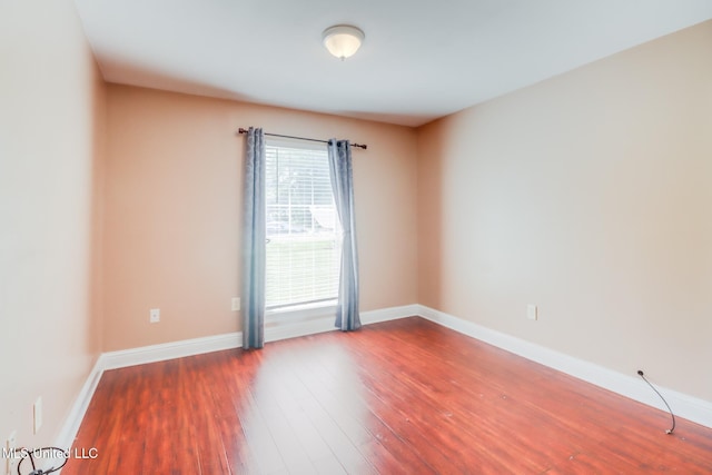 6909 N Rue Mornay, Biloxi, MS 39532 - unfurnished room featuring wood finished floors and baseboards