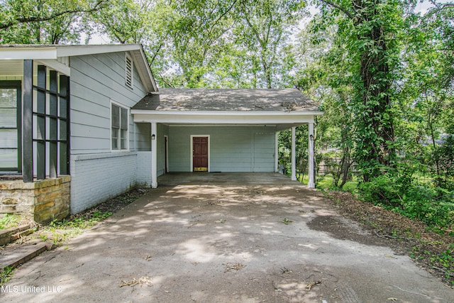 view of home's exterior with a carport