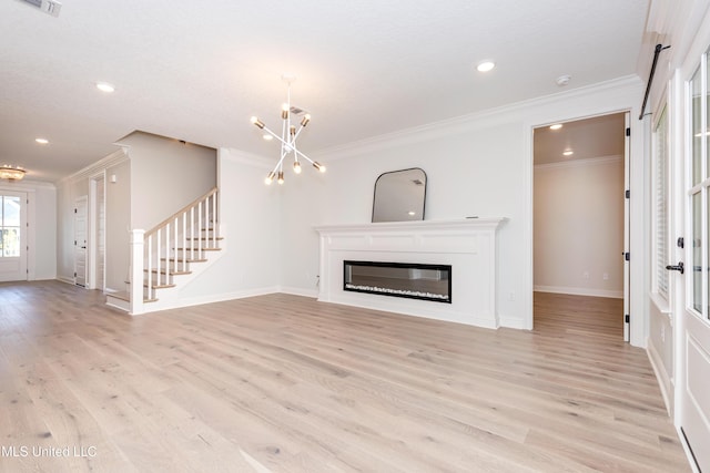 unfurnished living room featuring ornamental molding, a chandelier, and light hardwood / wood-style flooring