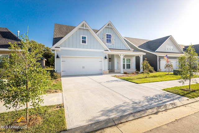 view of front of house featuring a garage and a front lawn