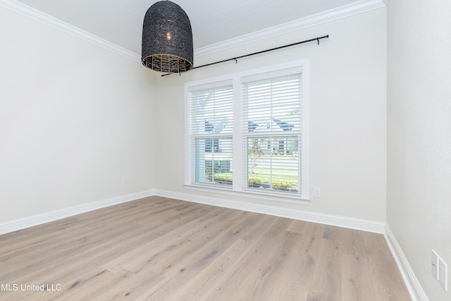 unfurnished room with ornamental molding and light hardwood / wood-style floors