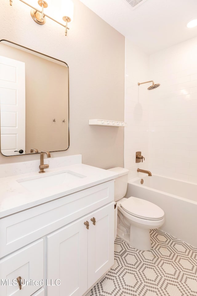 full bathroom featuring tile patterned floors, shower / washtub combination, toilet, and vanity