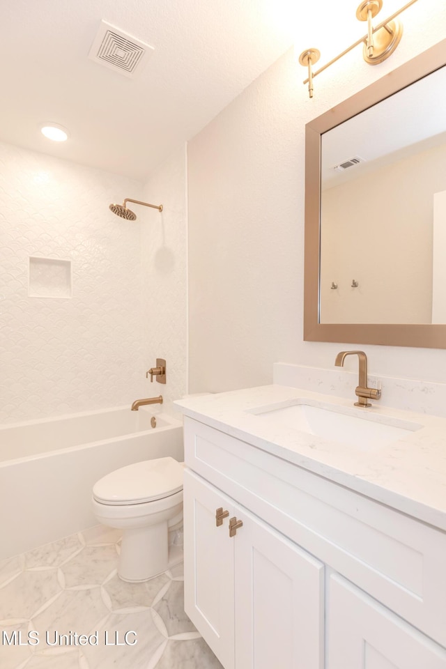 full bathroom featuring vanity, tiled shower / bath, tile patterned floors, and toilet