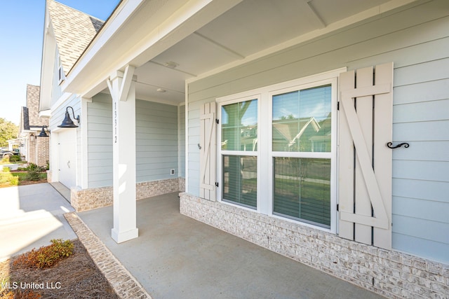 entrance to property with a patio area