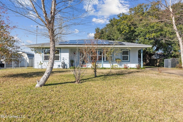 view of front of property with a front yard, solar panels, and a porch