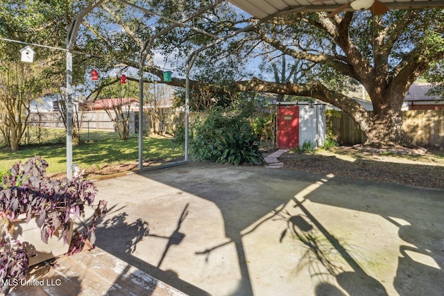 view of patio featuring a storage unit