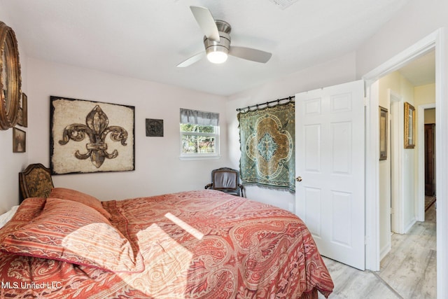 bedroom with ceiling fan and light hardwood / wood-style floors