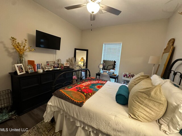 bedroom featuring ceiling fan and dark hardwood / wood-style flooring