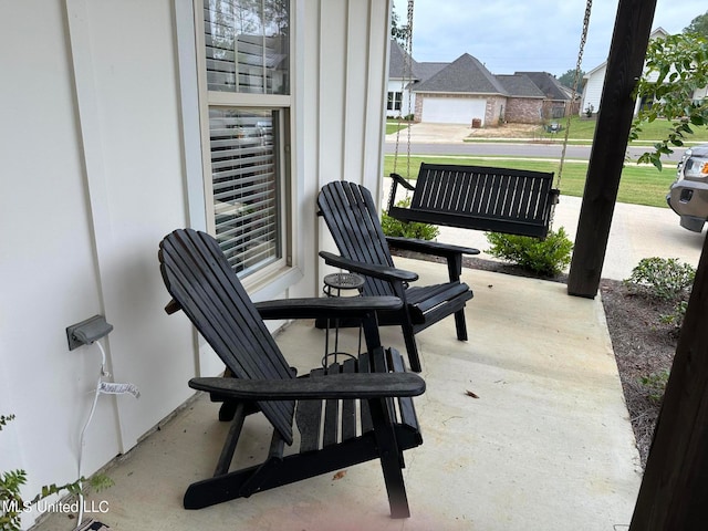 view of patio featuring a garage