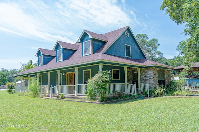 view of front of home with a front yard and a porch