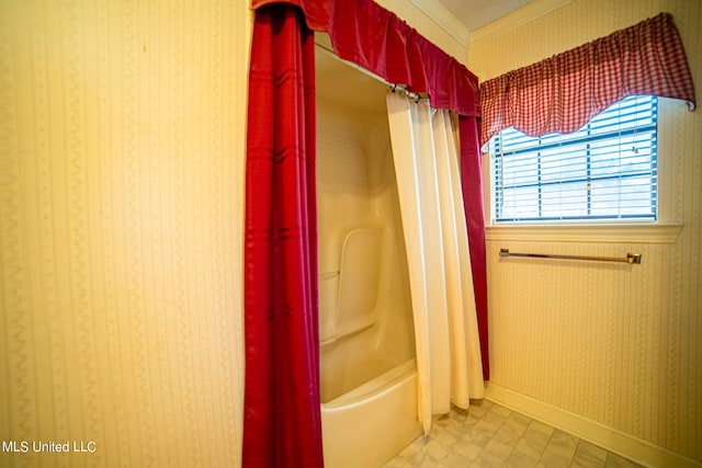 bathroom with crown molding and shower / bathtub combination with curtain