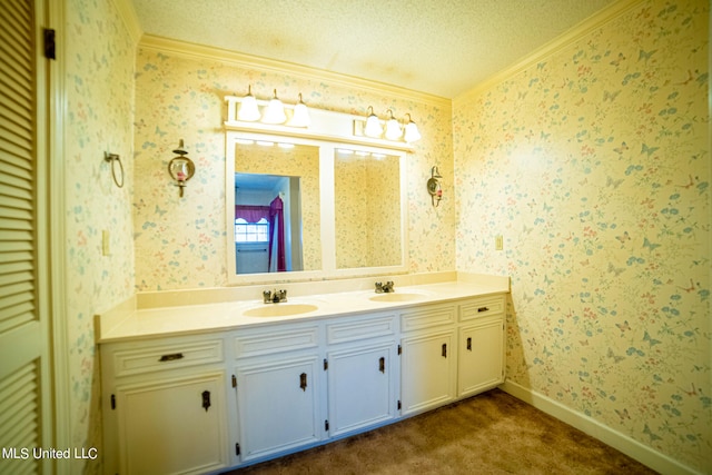 bathroom featuring vanity, crown molding, and a textured ceiling