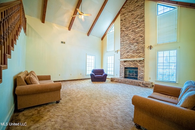 living room with a healthy amount of sunlight and high vaulted ceiling