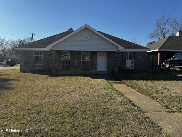 ranch-style house with a front lawn