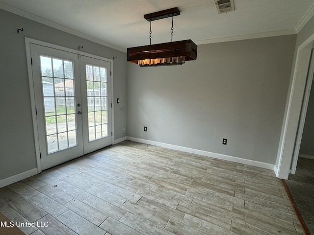 unfurnished dining area featuring french doors, light hardwood / wood-style floors, and ornamental molding