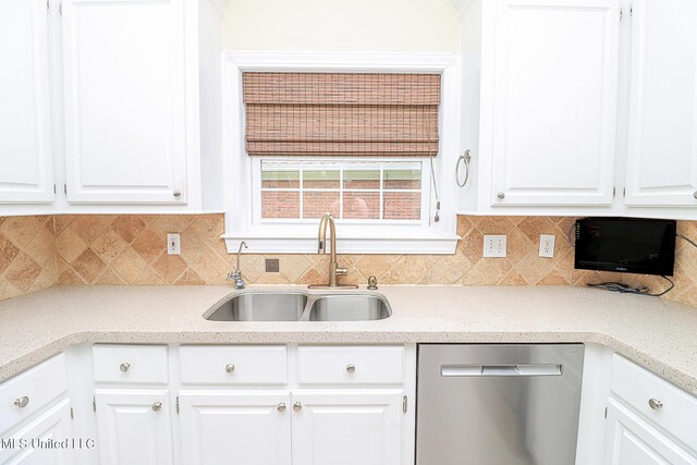 kitchen featuring light countertops, white cabinetry, a sink, and dishwasher