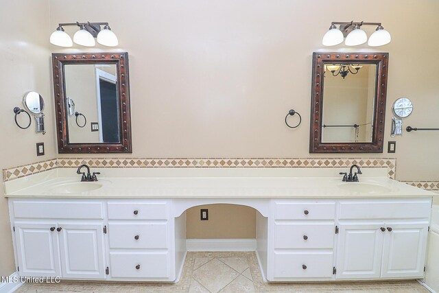full bath with a sink, backsplash, and double vanity