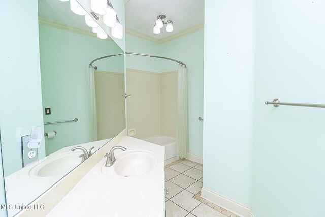 full bathroom featuring washtub / shower combination, vanity, tile patterned floors, baseboards, and ornamental molding