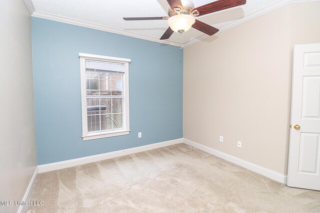 unfurnished room featuring carpet floors, baseboards, and ornamental molding