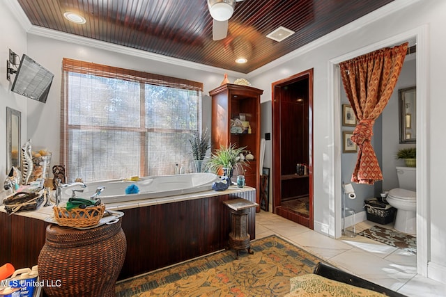 bathroom with ceiling fan, a washtub, toilet, wood ceiling, and ornamental molding