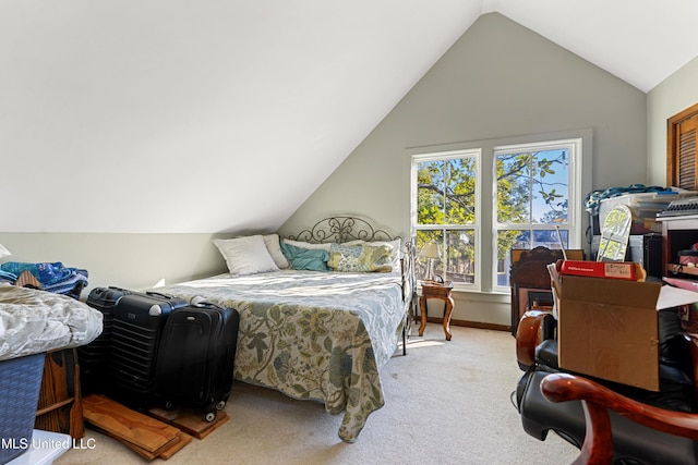 bedroom featuring light carpet and vaulted ceiling