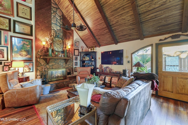 living room with high vaulted ceiling, hardwood / wood-style flooring, a fireplace, beam ceiling, and wood ceiling