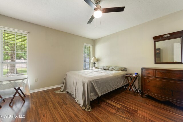403 Suzanne Ave, Long Beach, MS 39560 - bedroom featuring wood finished floors, multiple windows, and ceiling fan