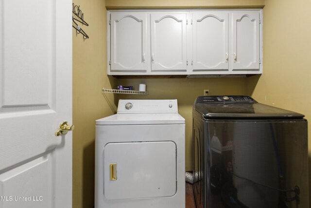 403 Suzanne Ave, Long Beach, MS 39560 - laundry room featuring independent washer and dryer and cabinet space