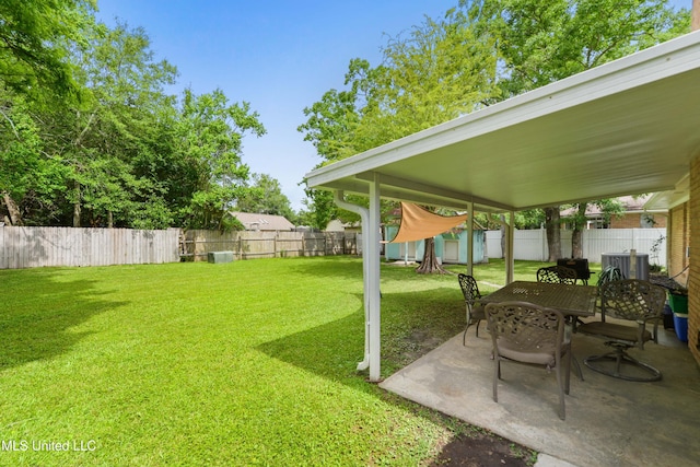 403 Suzanne Ave, Long Beach, MS 39560 - fenced backyard featuring a storage unit and a patio