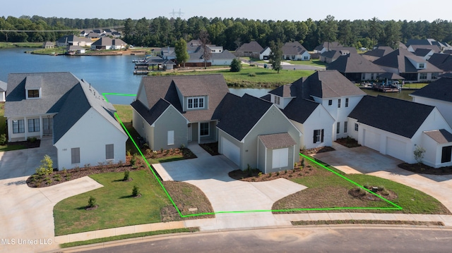 birds eye view of property with a water view