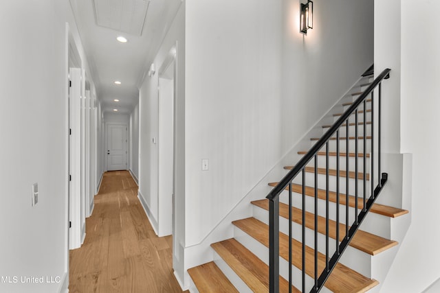 stairs with wood-type flooring