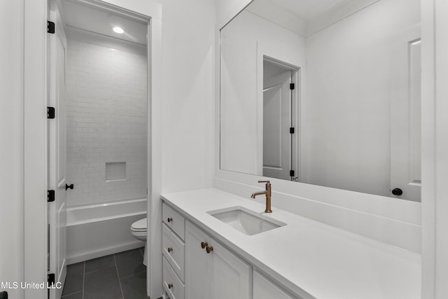 full bathroom with vanity, tiled shower / bath combo, toilet, and tile patterned flooring