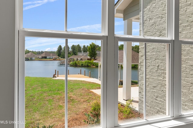 doorway to outside with a water view