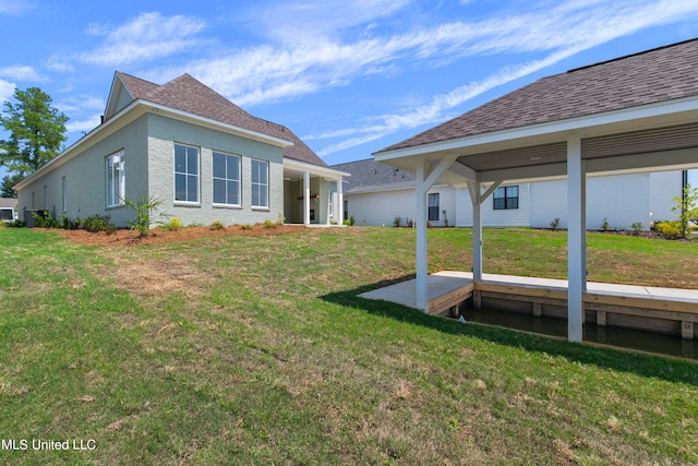 back of house with a yard