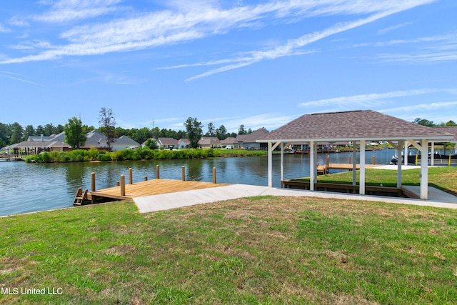 dock area featuring a water view and a yard