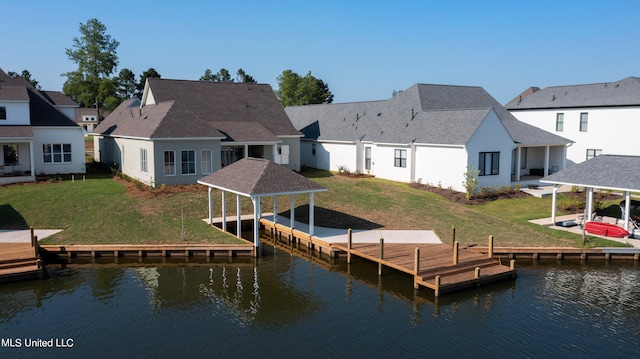 dock area featuring a gazebo, a water view, and a lawn